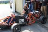 photograph of Alice Zhang and Jason Lieb pushing vehicle to event