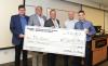 MLsploit team holds big check for winning Demo Day.