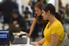Female student with an instructor working together at a laptop