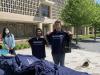 ECE students holding up ECE t-shirts at the Pre-Finals Student Wellness Drop-In where students could build their own care packages — with study supplies, snacks, and ECE swag — to prep for finals.