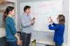 Researchers discussing brain signal analysis